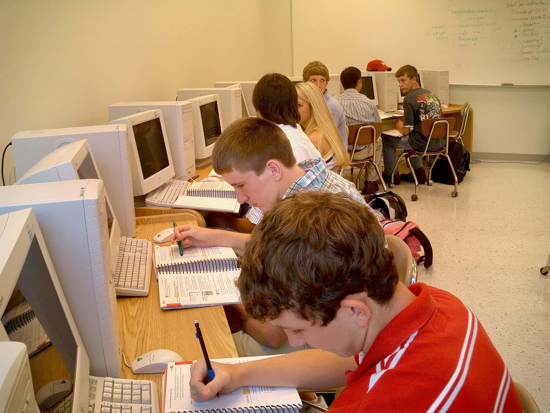 Students work at computers in a high school classroom